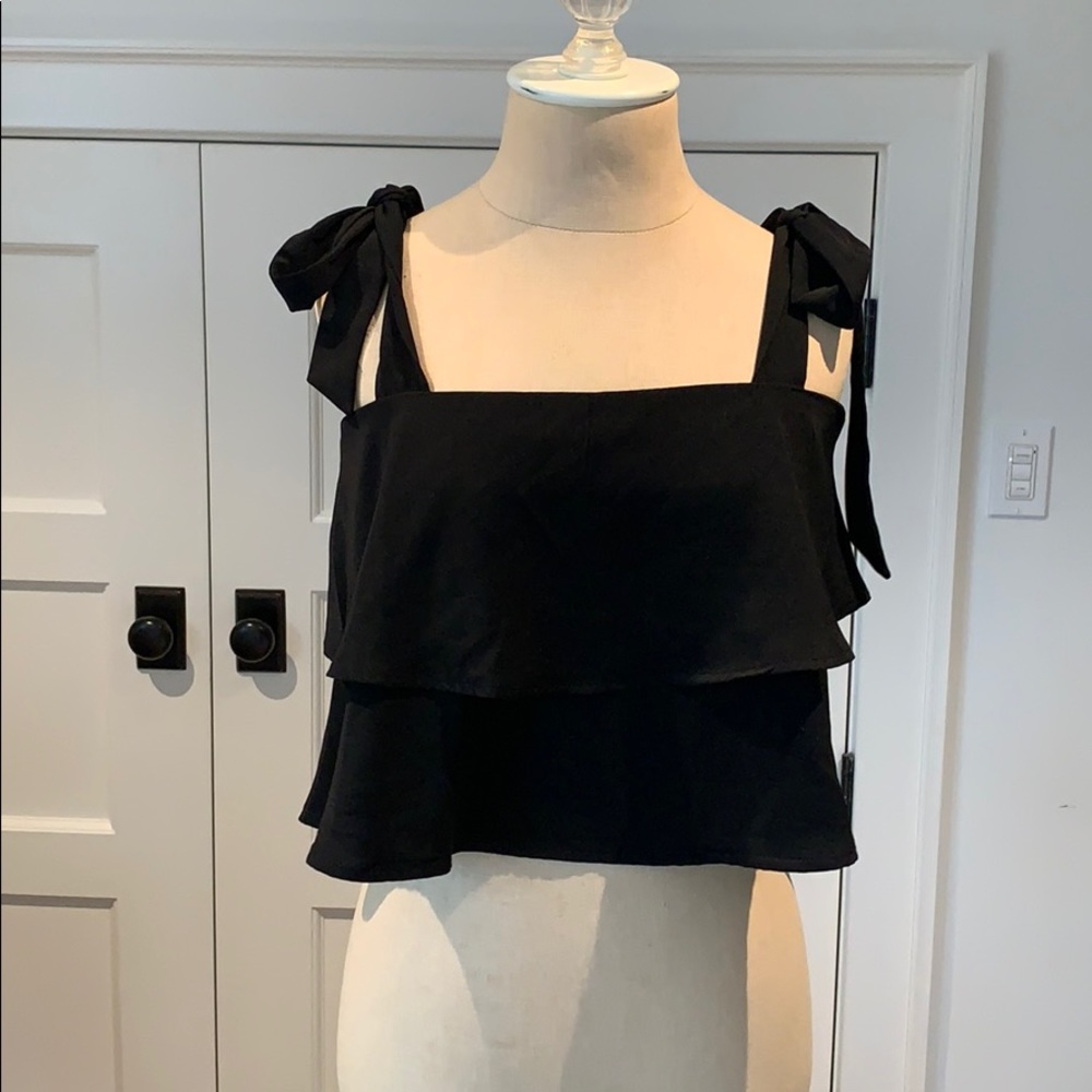 By the way. Black ruffle top